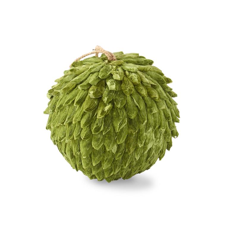 Green decorative ball with textured surface on a white background