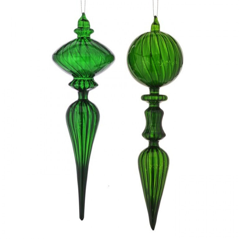 Two green glass Christmas ornaments with a white background