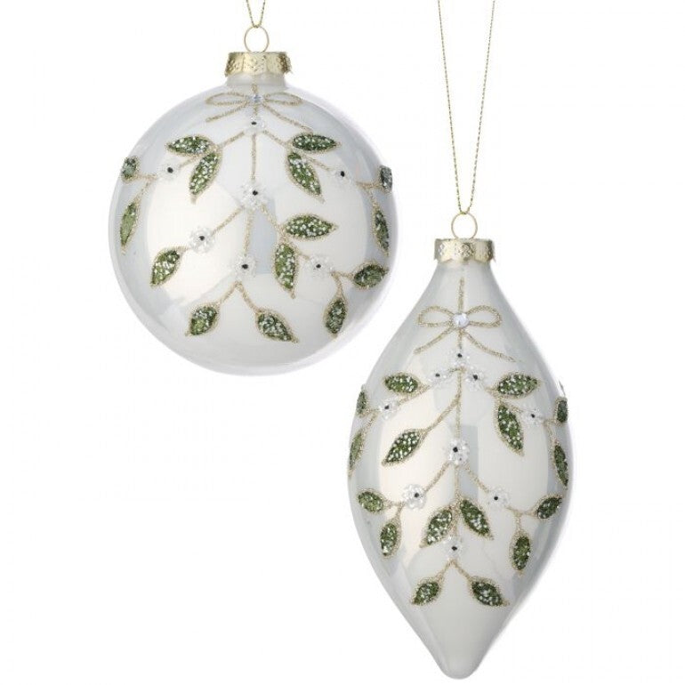 Two decorative Christmas ornaments with leaf patterns on a white background