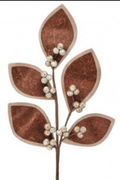 A decorative faux botanical branch with five textured brown leaves and small clusters of white faux pearls on a plain white background.